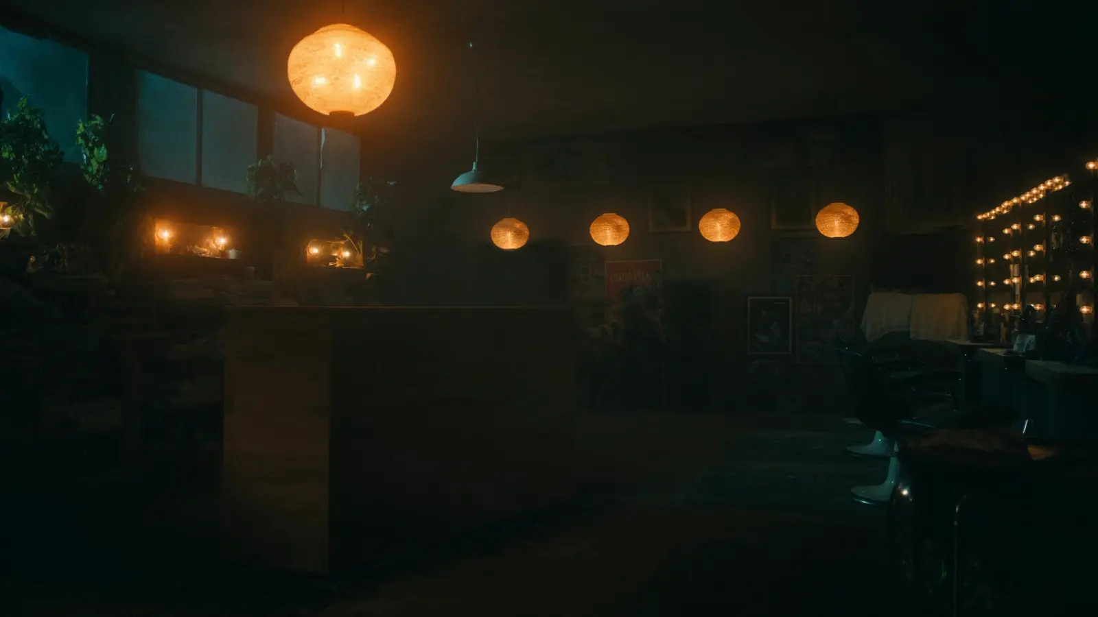 A salon closed for the night, warm lanterns still glowing